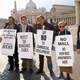 Demonstrators picket outside the proposed future site of The Vatican Downtown Community Center.